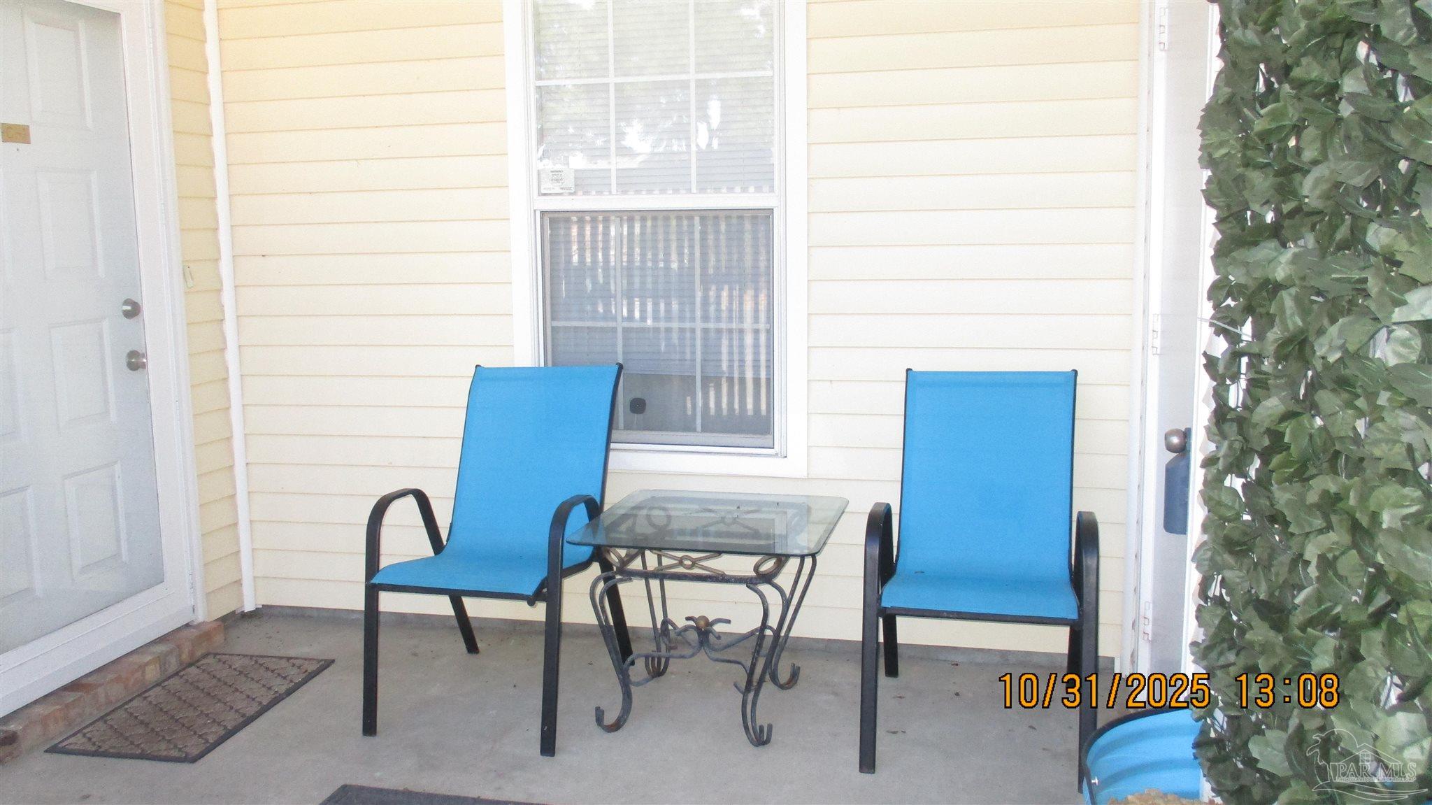 a view of a room with a table and chairs and couches chair