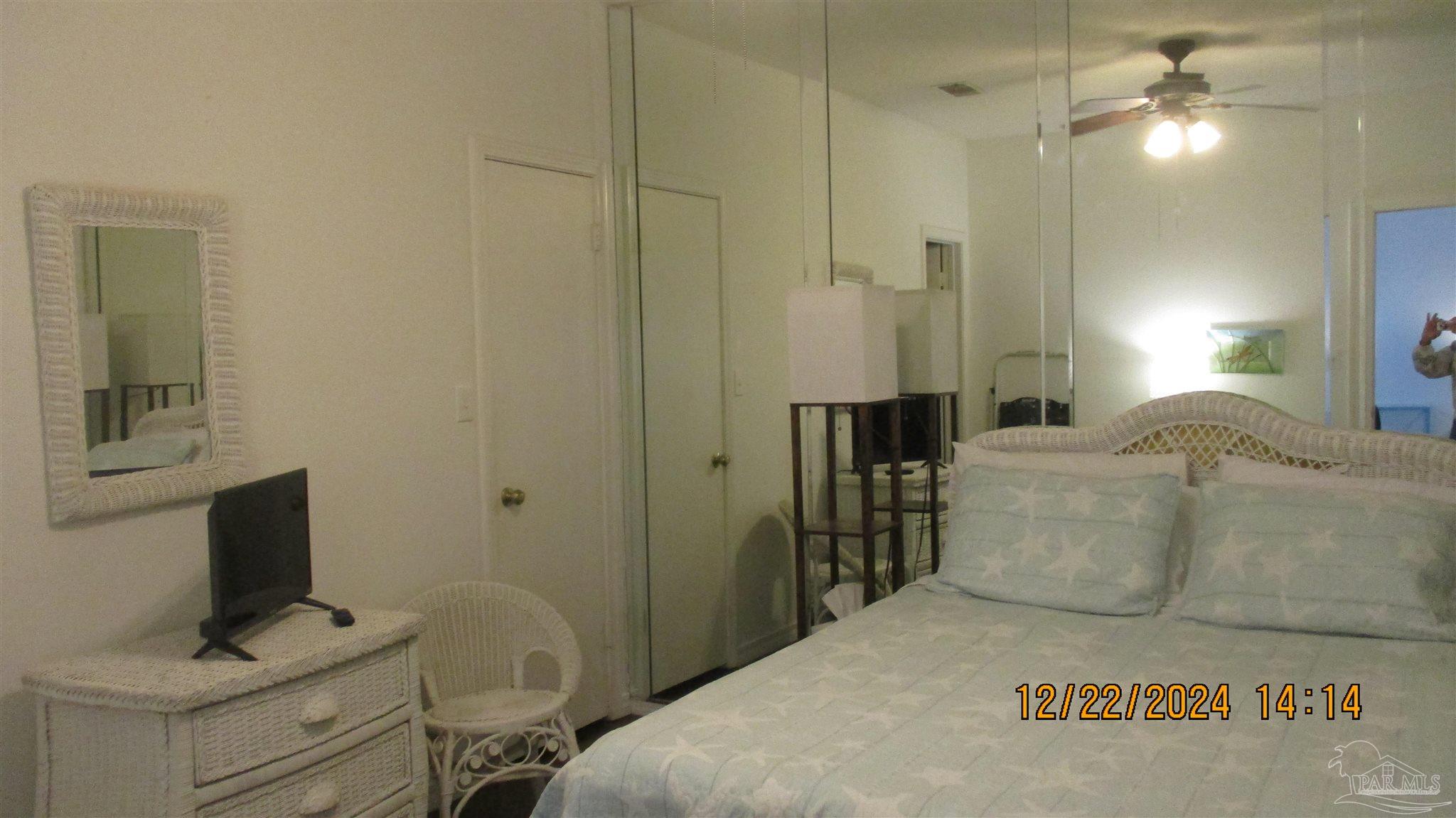 501 East Burgess Road, Unit C1 Pensacola, FL 32504 - Photo 13 of 16 a spacious bedroom with a bed and a flat screen tv