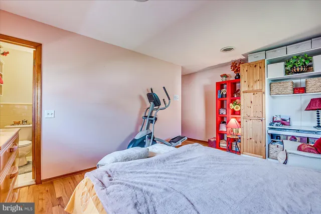 a bed room with a bed and a chair