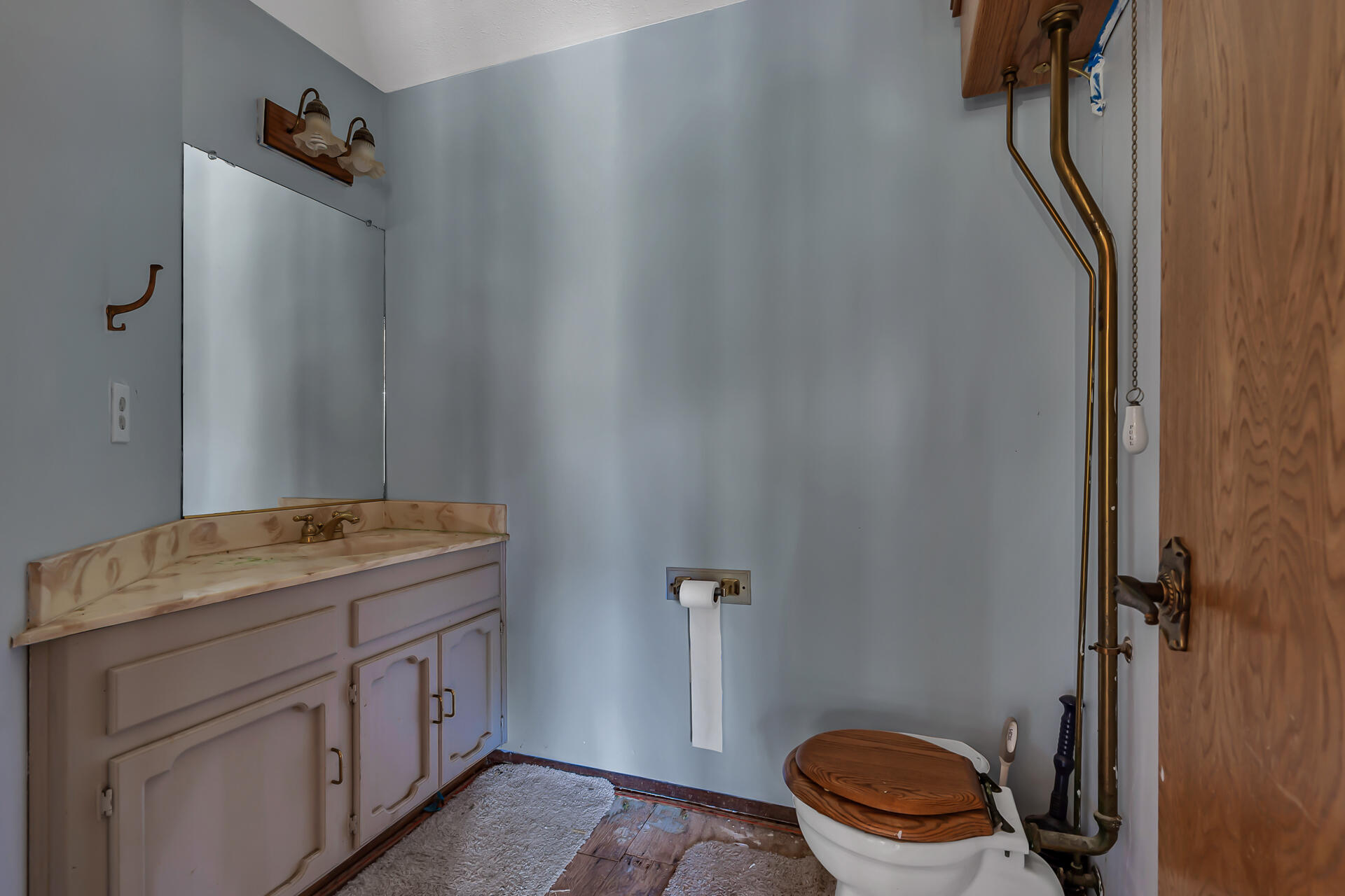 15368 Star Flower Road Oak Run, CA 96069 - Photo 62 of 63 a bathroom with a granite countertop toilet and a sink