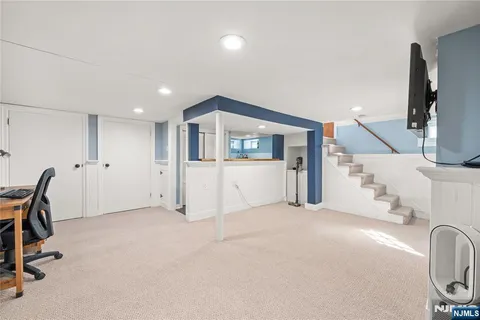 a view of a livingroom with a staircase