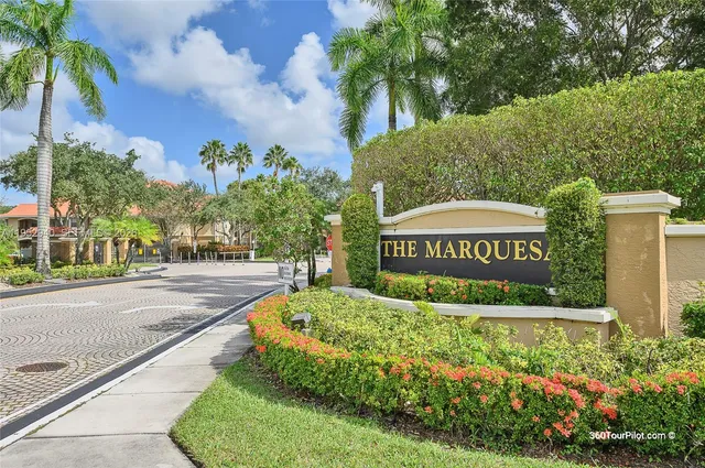 a view of a garden with a building in the background