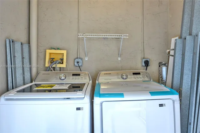 a utility room with dryer and washer