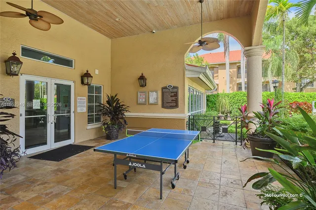 a view of a chairs and table in a backyard