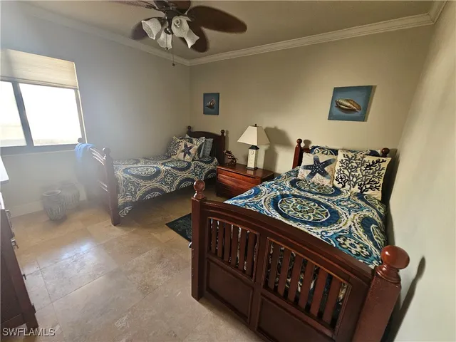 a bedroom with furniture and a window