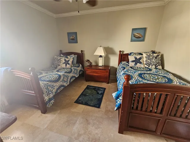 a bedroom with a bed and flat screen tv