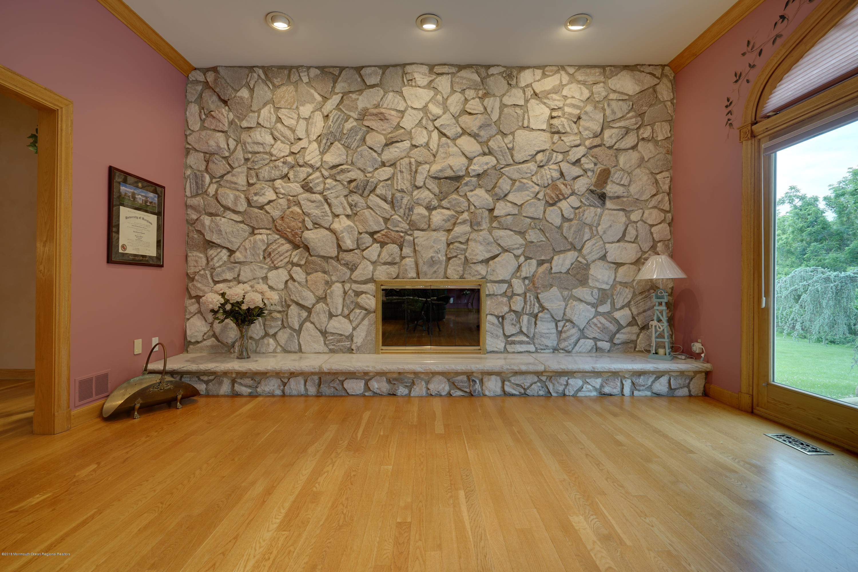 18 Riverside Lane Holmdel, NJ 07733 - Photo 17 of 53 Stone Wall with a Wood Burning Fireplace