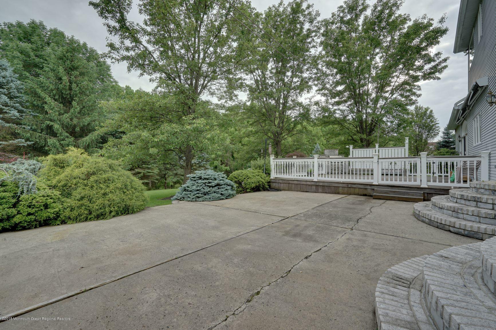 18 Riverside Lane Holmdel, NJ 07733 - Photo 52 of 53 Concrete Patio with Landscaping