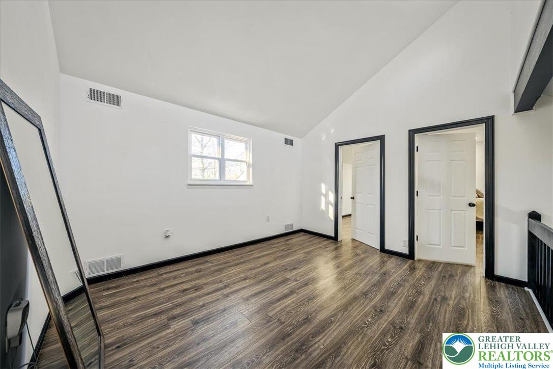 3260 Bluebird Drive Bushkill, PA 18324 - Photo 14 of 28 a view of an empty room with wooden floor and a window