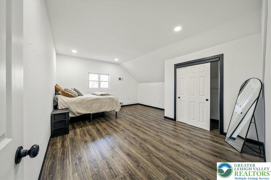 3260 Bluebird Drive Bushkill, PA 18324 - Photo 18 of 28 a living room with furniture and a wooden floor