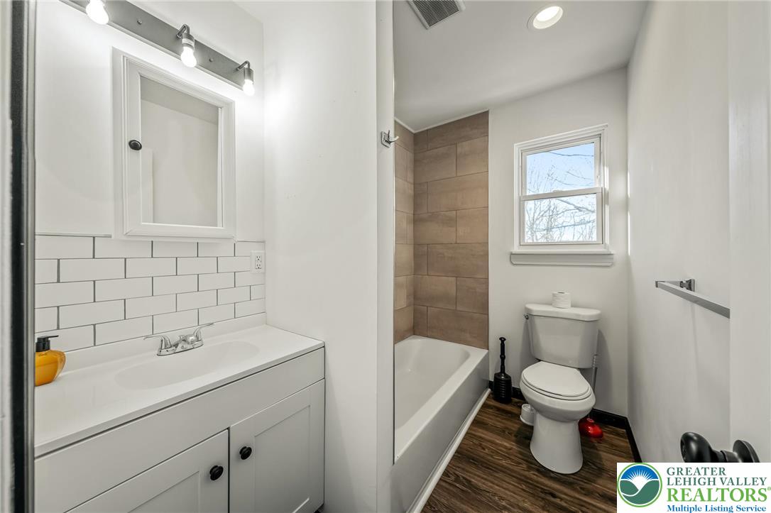 3260 Bluebird Drive Bushkill, PA 18324 - Photo 20 of 28 a bathroom with a sink toilet and shower