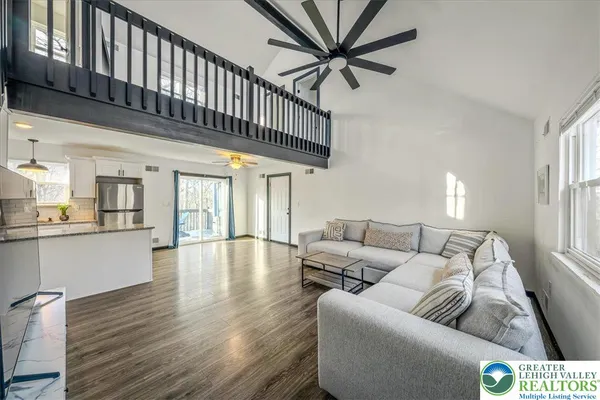 a living room with furniture and a large window