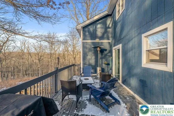 a view of balcony with furniture and wooden deck
