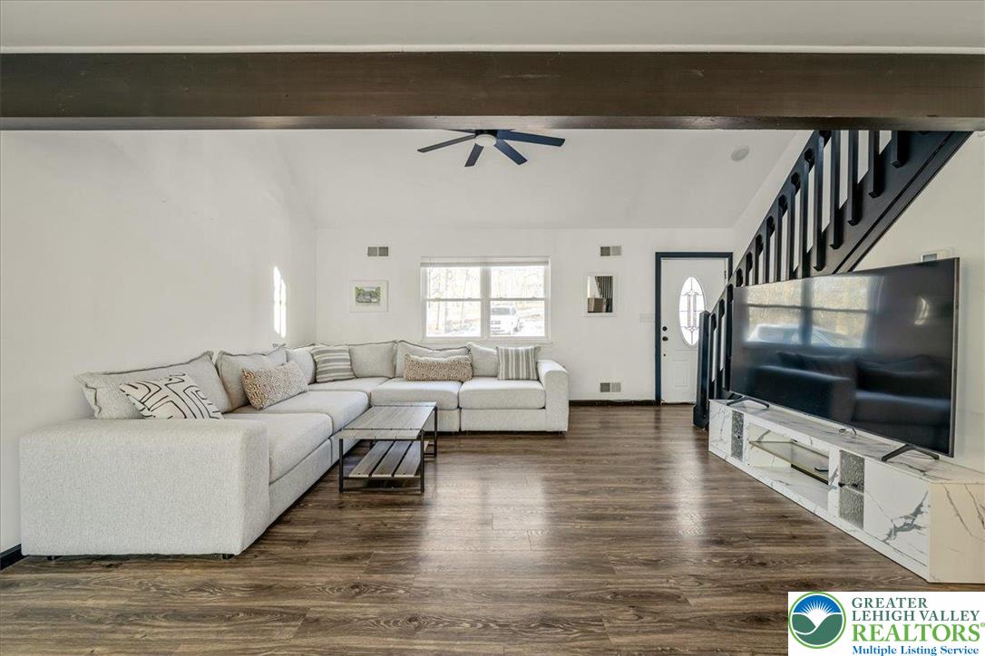 3260 Bluebird Drive Bushkill, PA 18324 - Photo 3 of 28 a living room with furniture and a flat screen tv