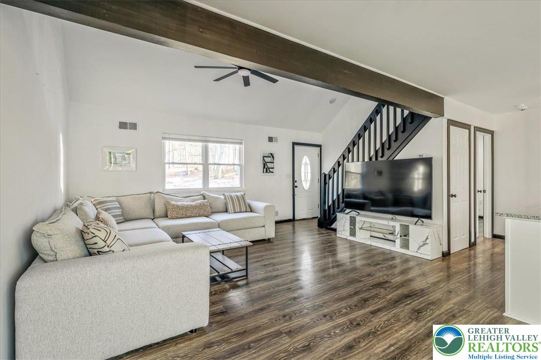 3260 Bluebird Drive Bushkill, PA 18324 - Photo 4 of 28 a living room with furniture and a flat screen tv