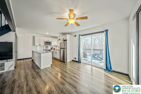 a view of a living room and a flat screen tv