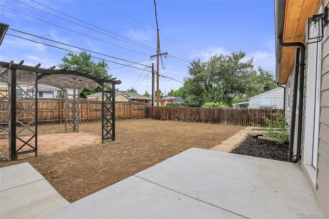 a view of a backyard with a patio