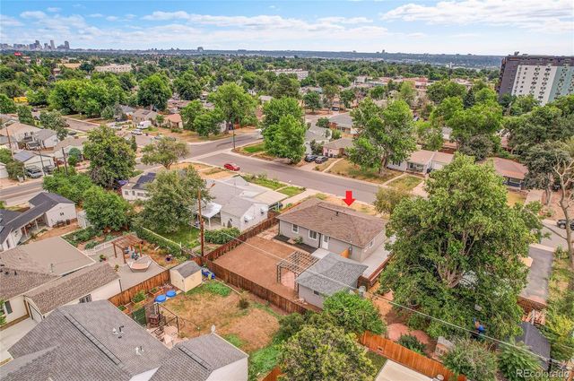 an aerial view of residential houses with outdoor space and street view