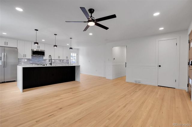 a view of kitchen with wooden floor and window