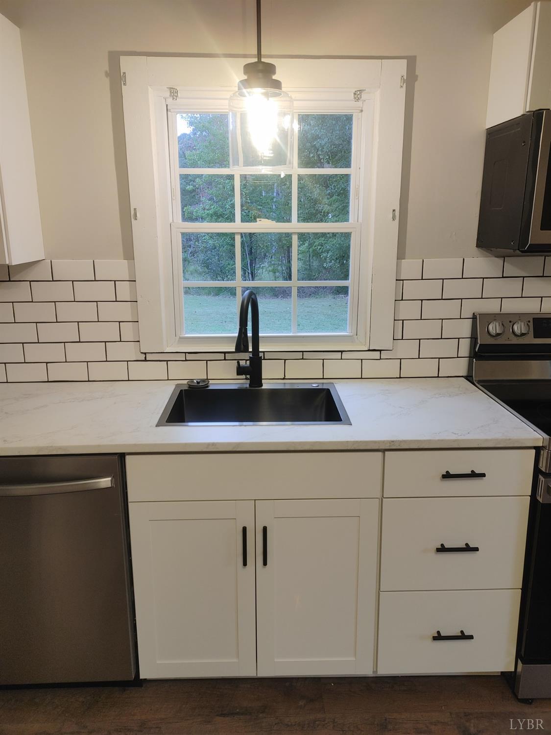 7143 Abilene Road Farmville, VA 23901 - Photo 11 of 38 a kitchen with a sink and a window