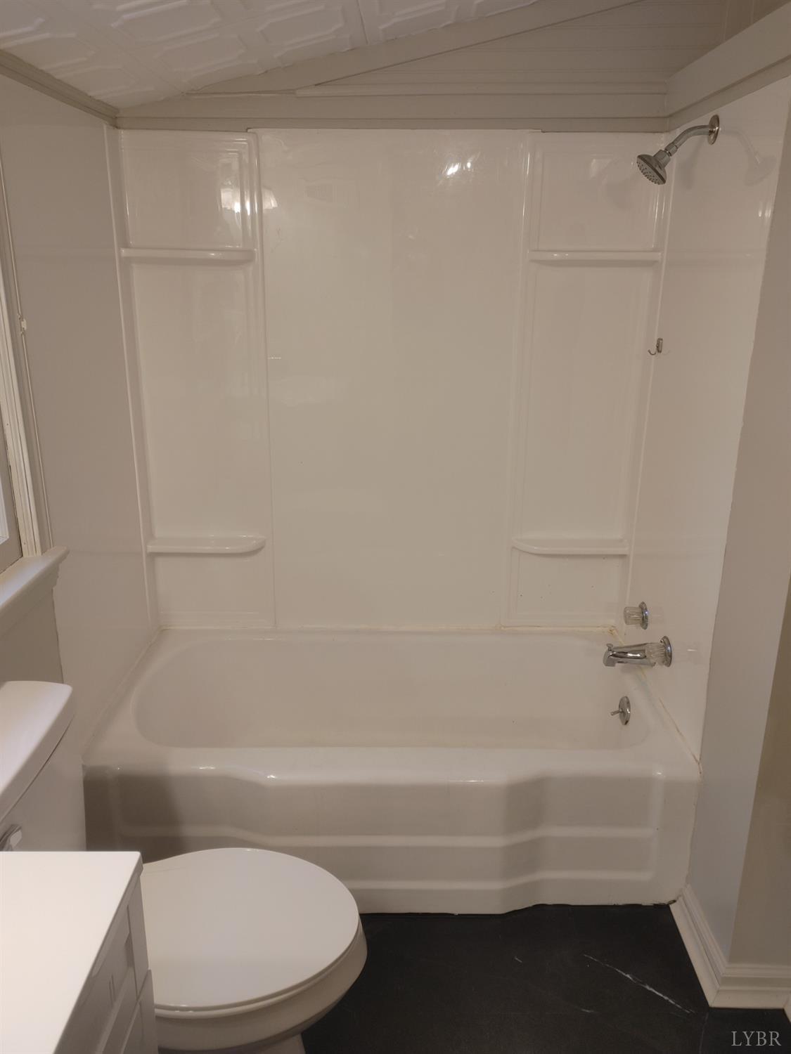 7143 Abilene Road Farmville, VA 23901 - Photo 20 of 38 a bathroom with a bathtub and a toilet