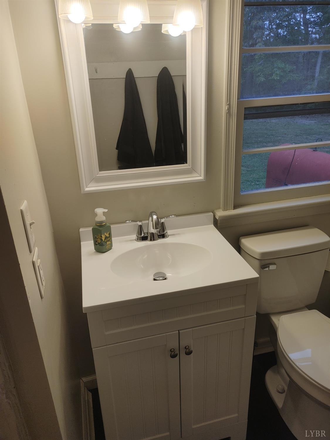7143 Abilene Road Farmville, VA 23901 - Photo 22 of 38 a bathroom with a sink and a mirror