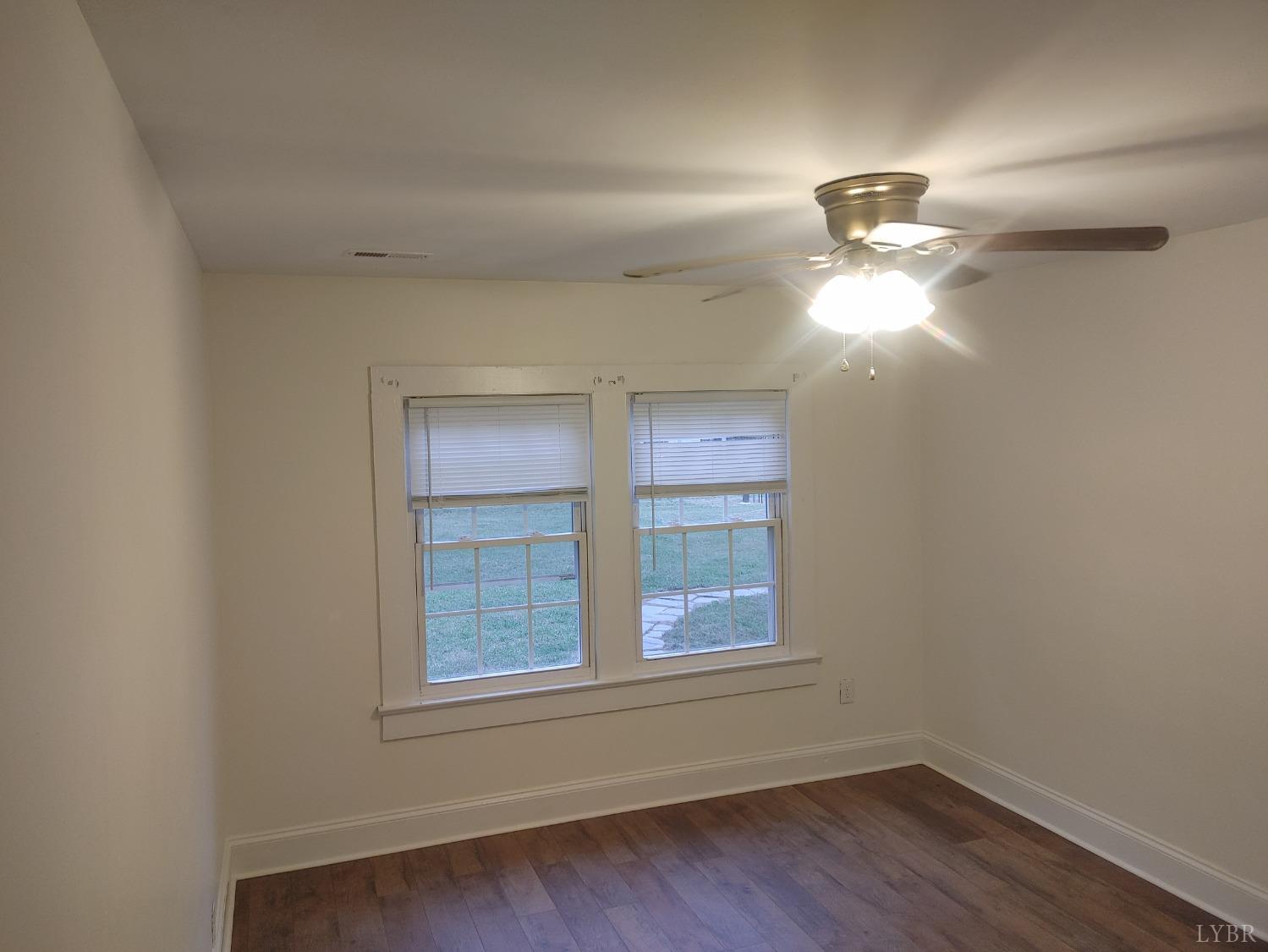 7143 Abilene Road Farmville, VA 23901 - Photo 24 of 38 wooden floor in an empty room with a window