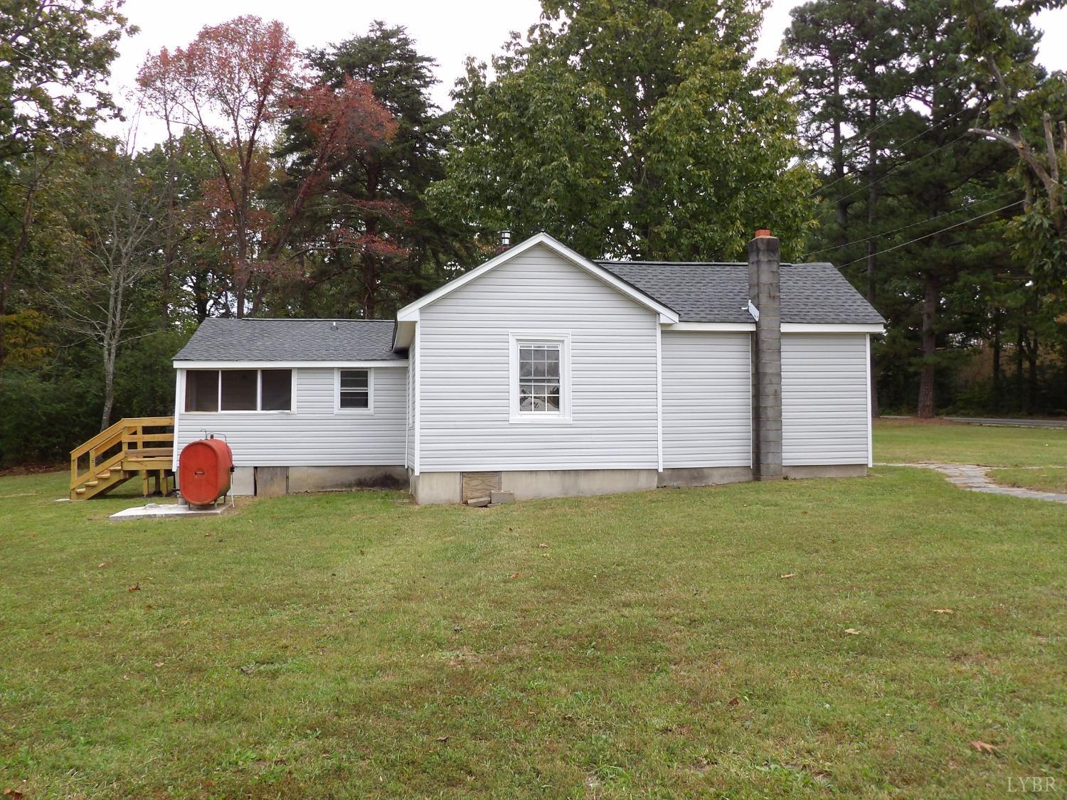 7143 Abilene Road Farmville, VA 23901 - Photo 28 of 38 a backyard of a house with table and chairs