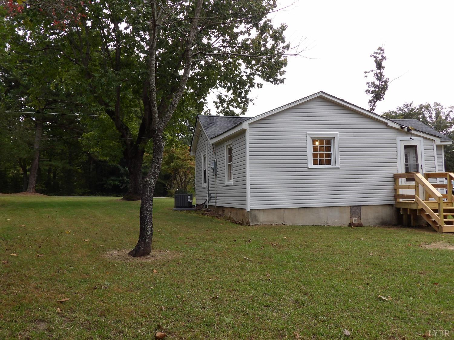 7143 Abilene Road Farmville, VA 23901 - Photo 30 of 38 a view of a house with a backyard
