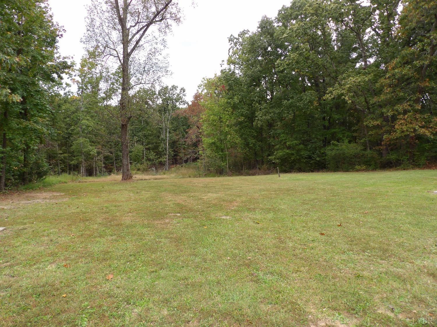 7143 Abilene Road Farmville, VA 23901 - Photo 32 of 38 a view of a field with trees in the background