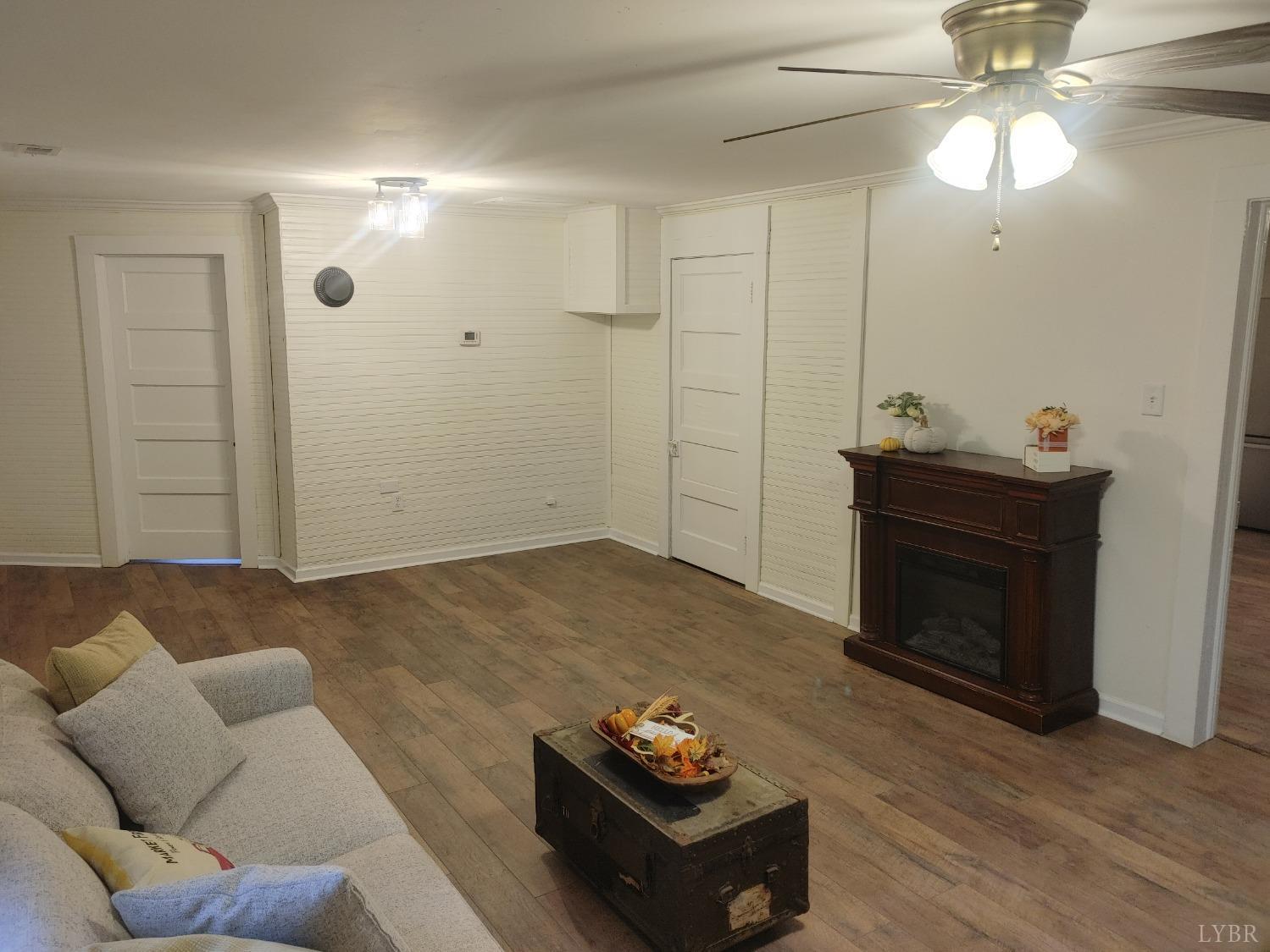7143 Abilene Road Farmville, VA 23901 - Photo 5 of 38 a living room with furniture and a fireplace