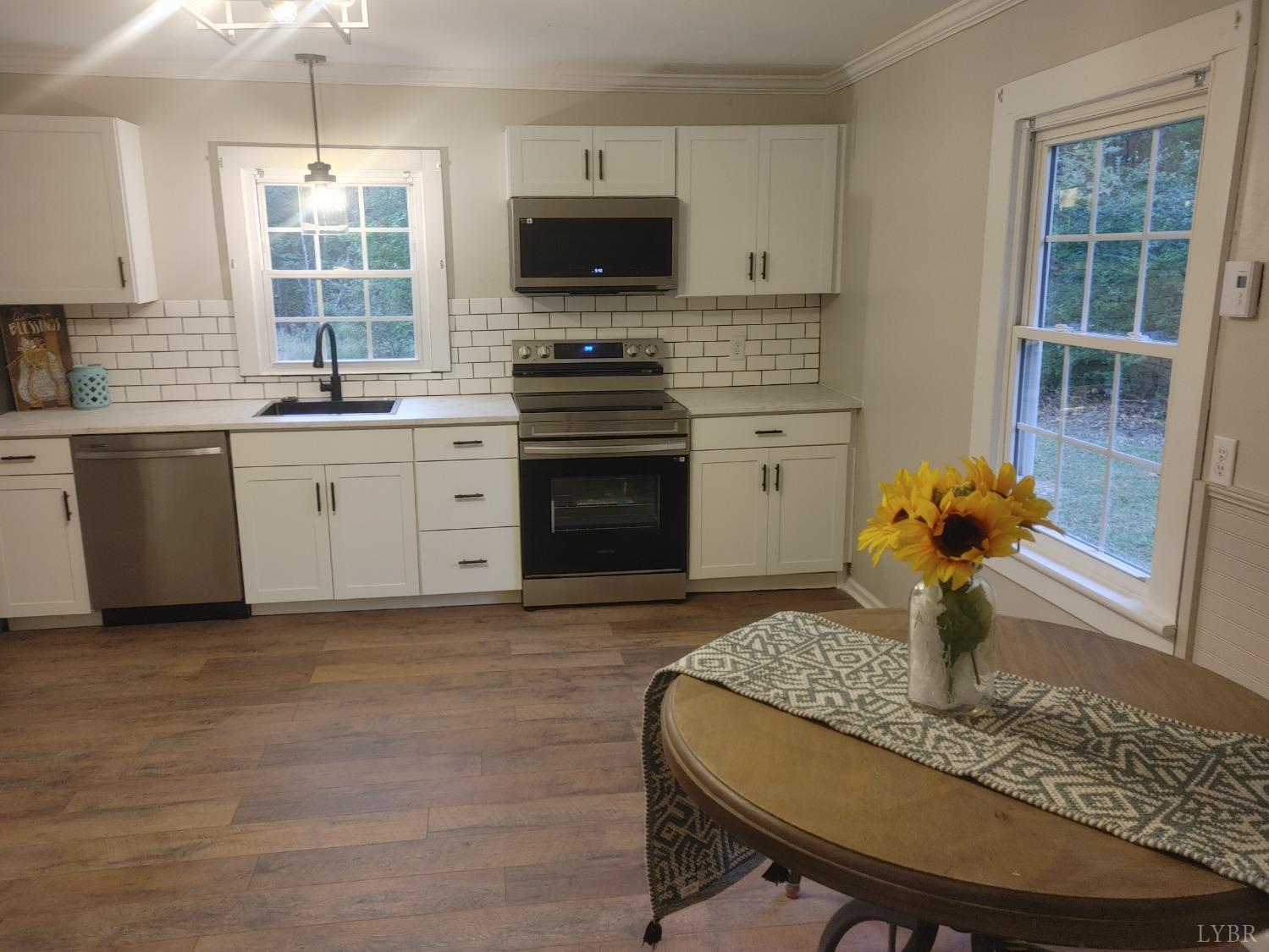 7143 Abilene Road Farmville, VA 23901 - Photo 7 of 38 a kitchen with a sink stove and window