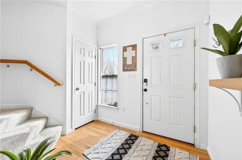 a view of bedroom with furniture and wooden floor