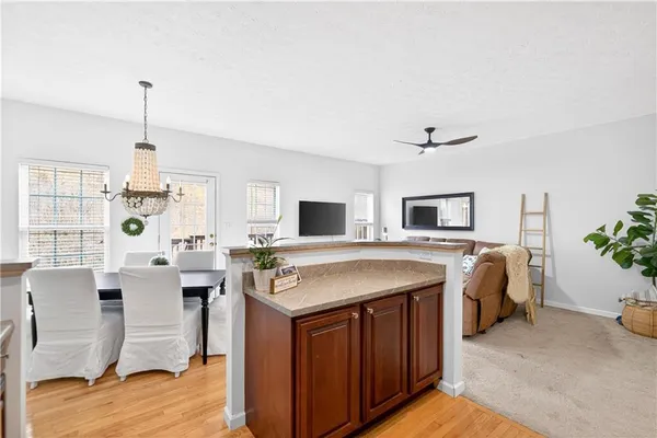 a view of a living room and kitchen