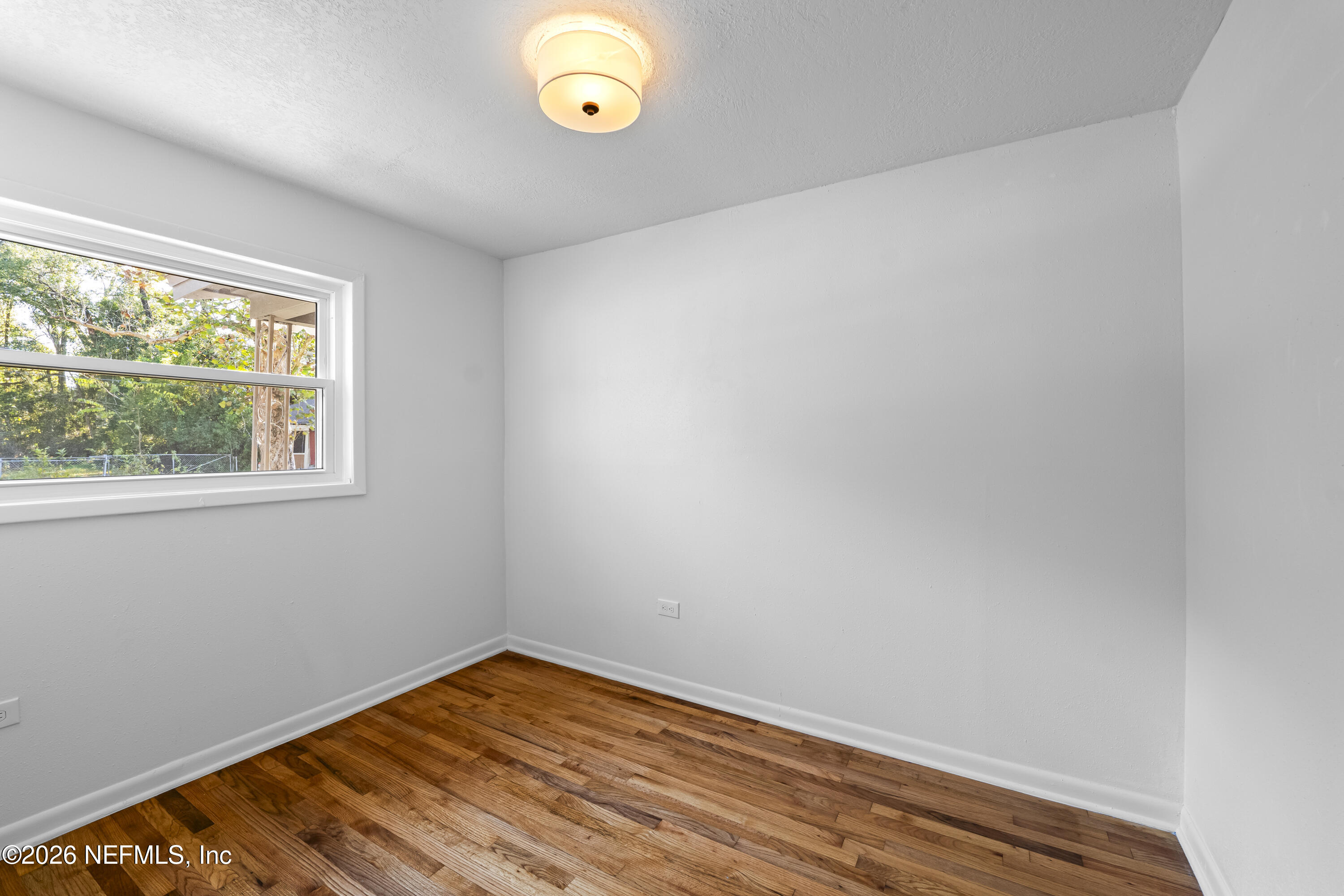 2389 Hilly Road Jacksonville, FL 32208 - Photo 12 of 25 an empty room with a window
