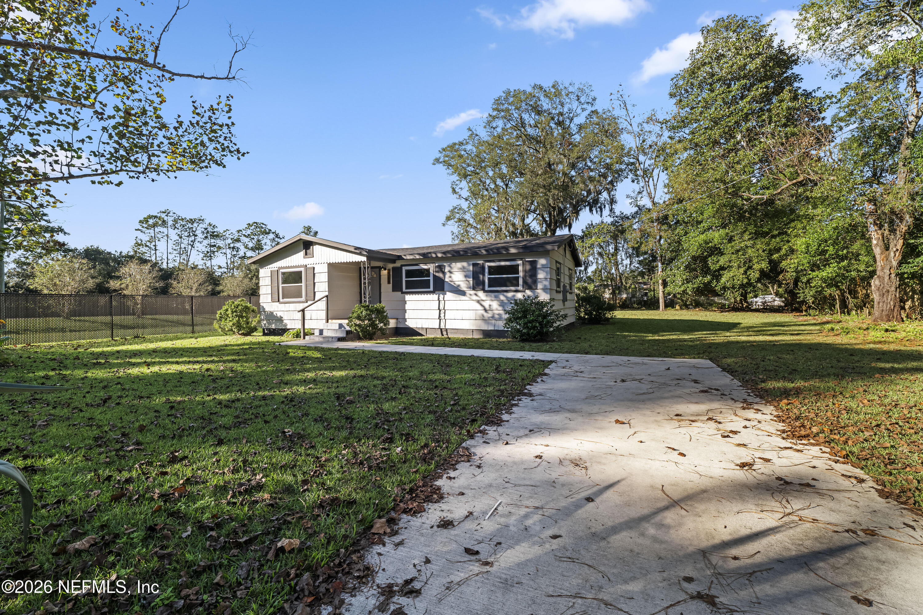 2389 Hilly Road Jacksonville, FL 32208 - Photo 20 of 25 a view of a house with a yard