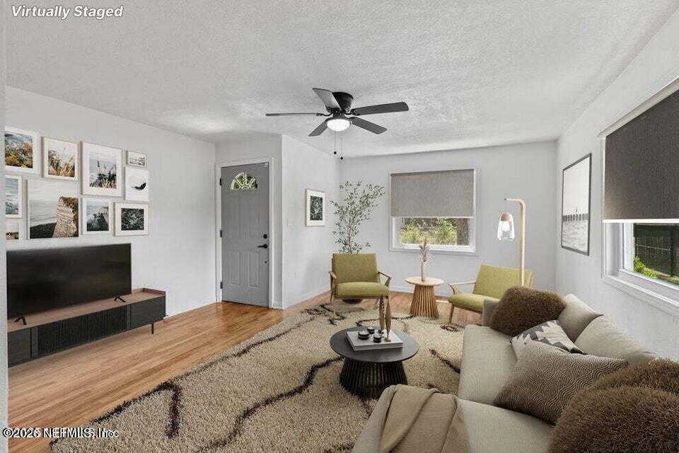 2389 Hilly Road Jacksonville, FL 32208 - Photo 2 of 25 a living room with furniture and a flat screen tv