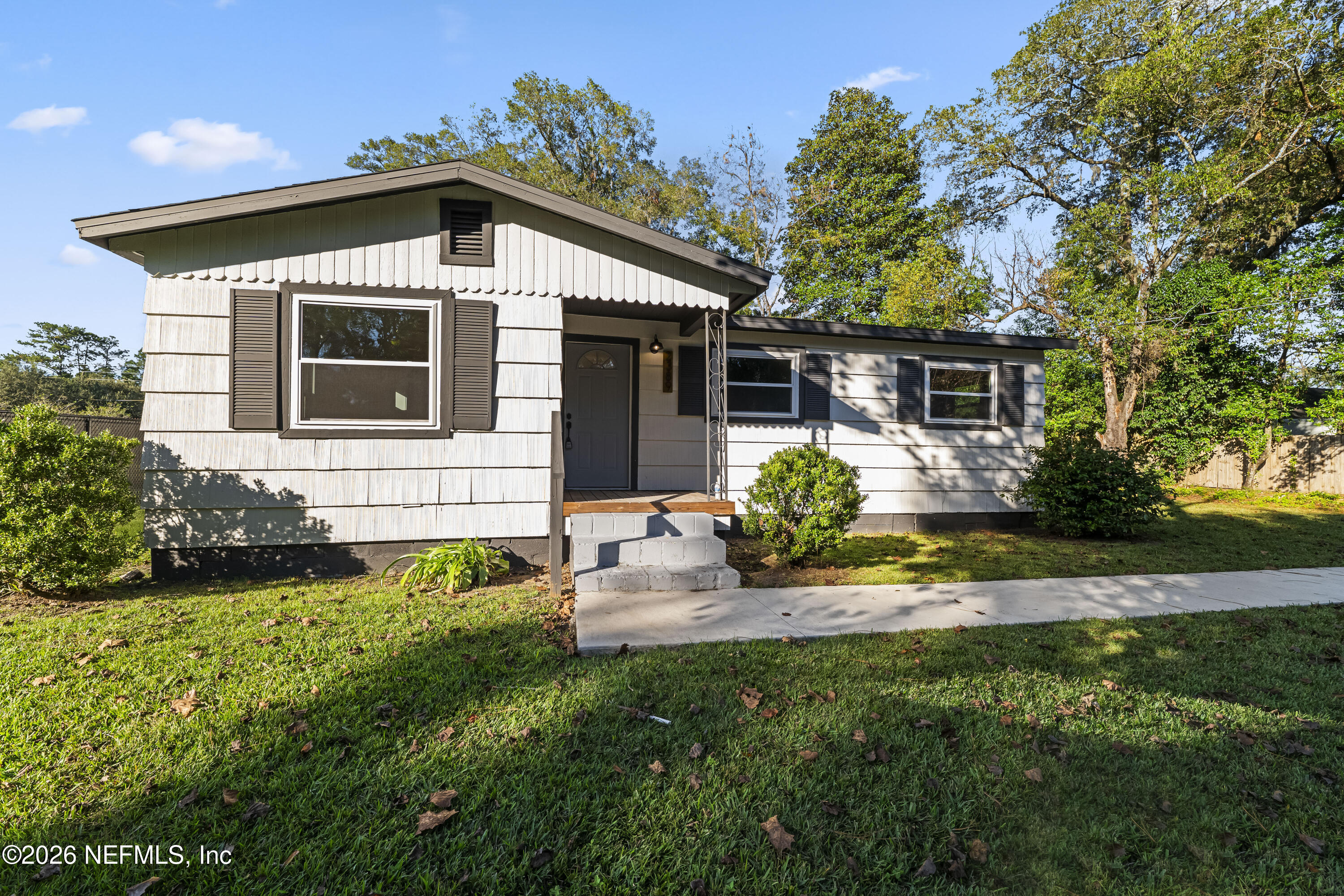 2389 Hilly Road Jacksonville, FL 32208 - Photo 25 of 25 a front view of a house with a yard