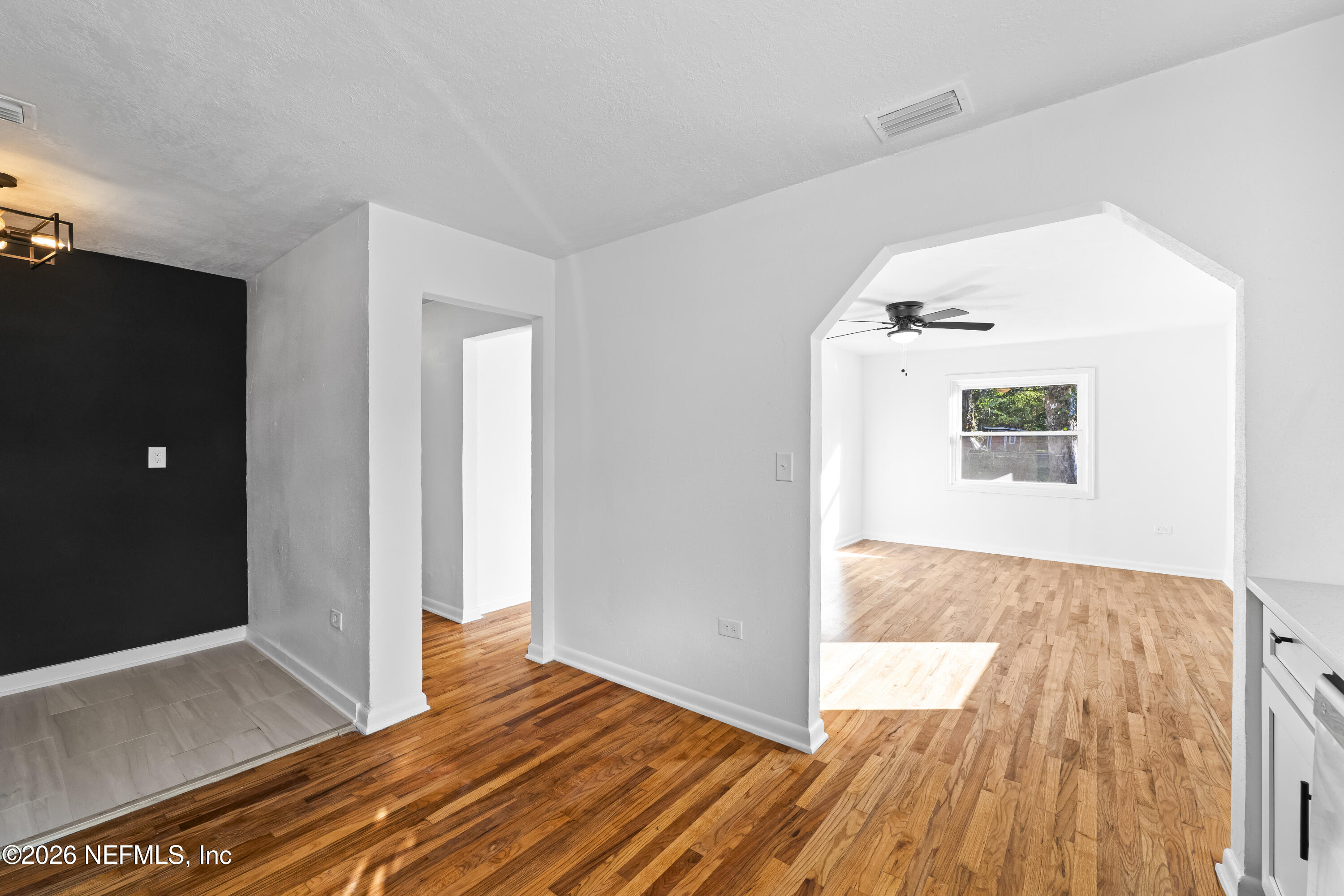2389 Hilly Road Jacksonville, FL 32208 - Photo 6 of 25 a view of hallway with wooden floor