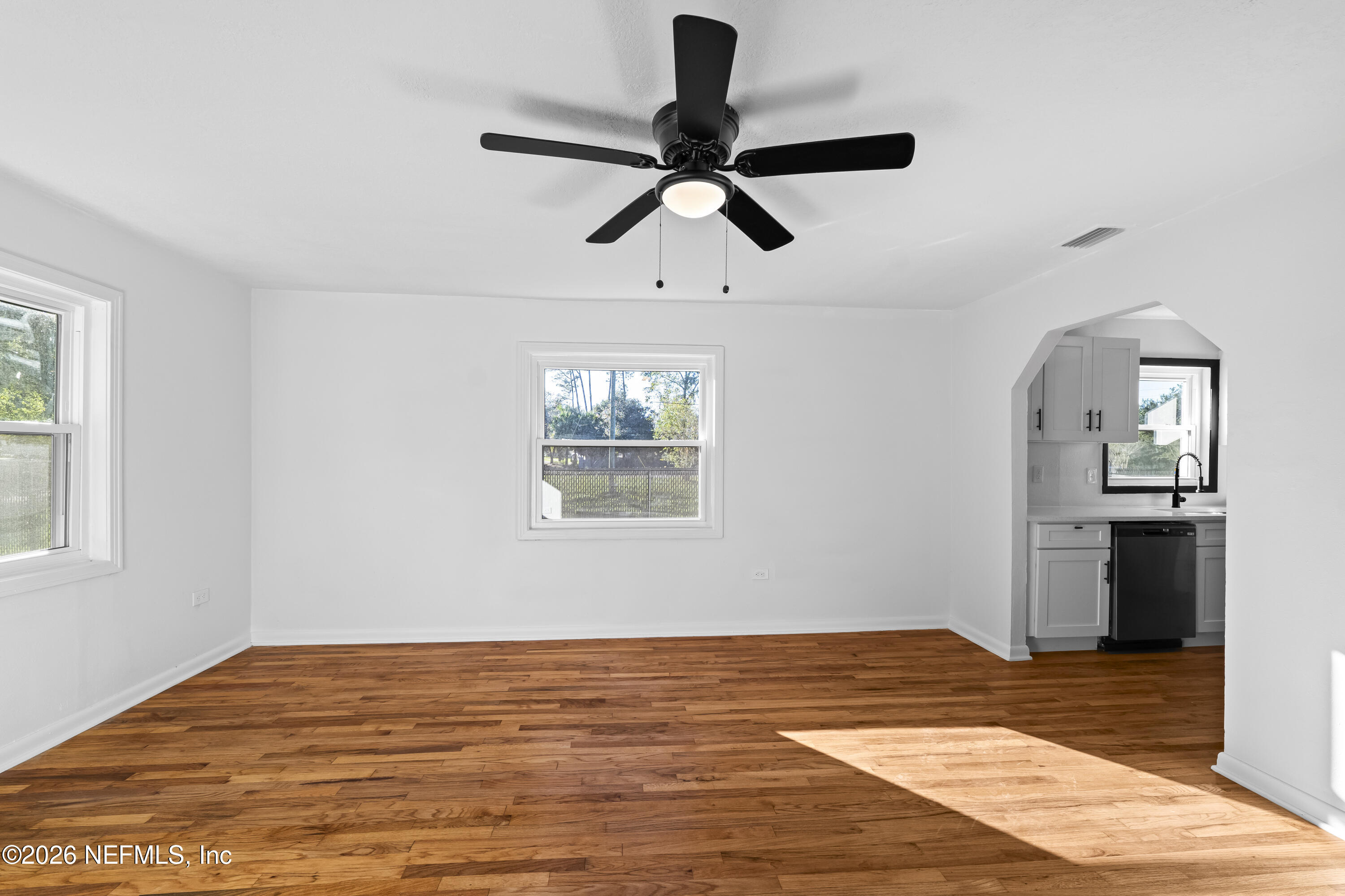 2389 Hilly Road Jacksonville, FL 32208 - Photo 8 of 25 a view of a room window and wooden floor