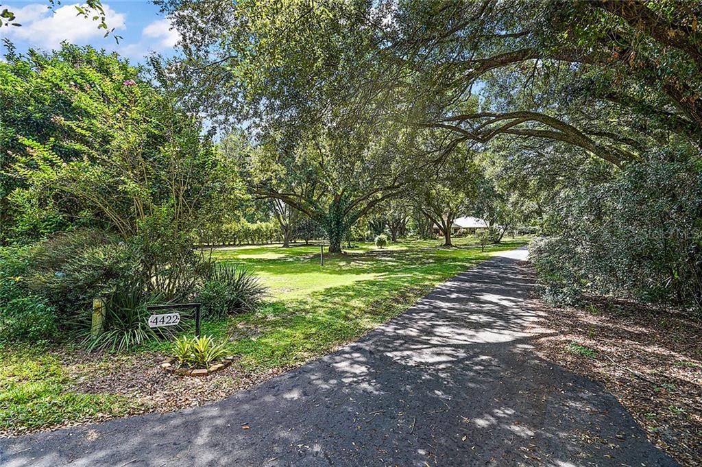 Welcome to 4422 Round Lake Rd. Apopka! 4 Acre property offers a beautiful park like setting and two homes.