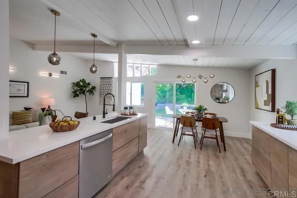 a very nice looking dining room with a large window