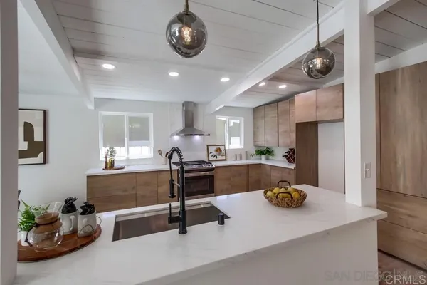 a kitchen with a table and chairs
