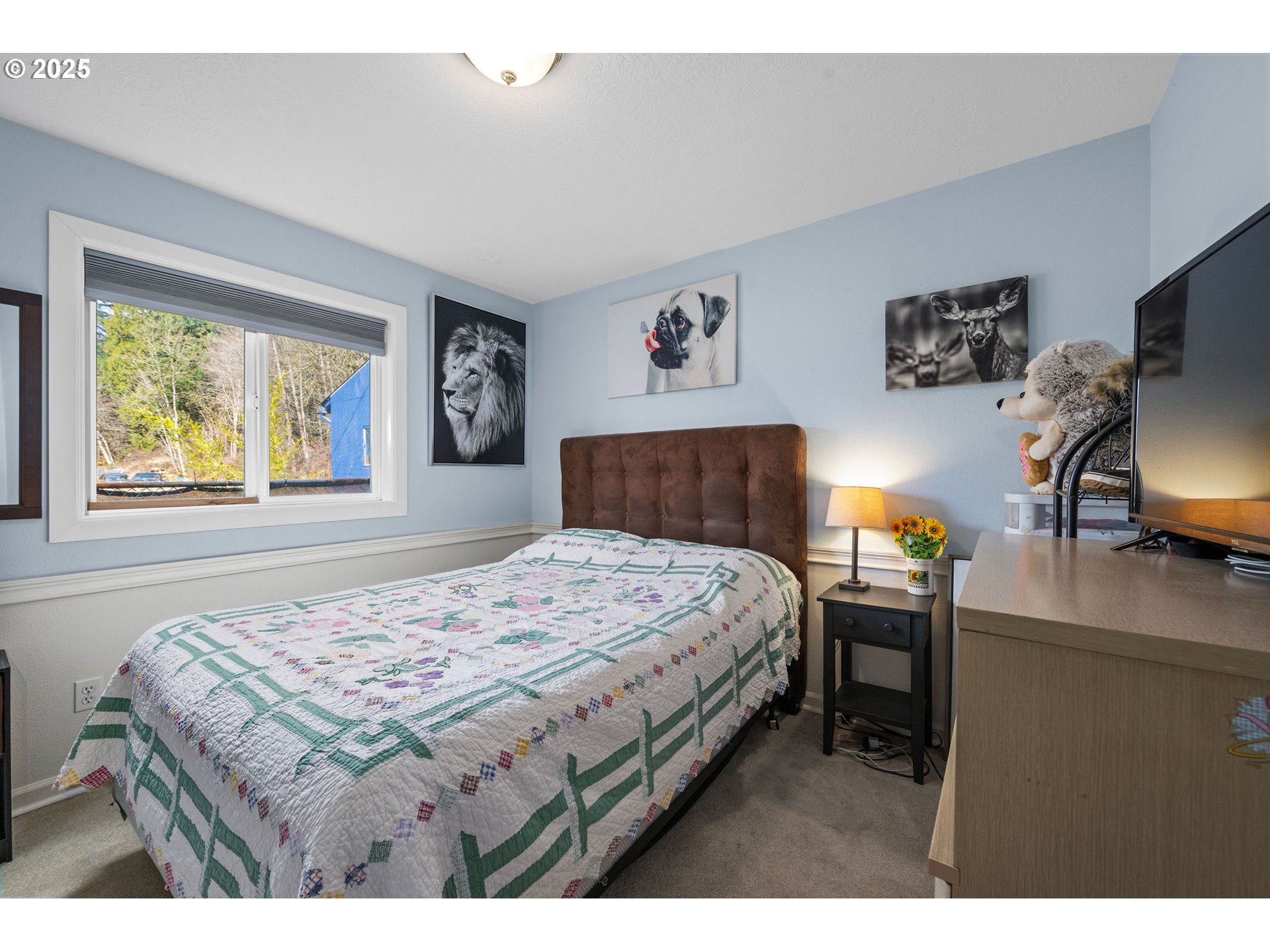 1390 Swedetown Road Clatskanie, OR 97016 - Photo 11 of 42 a bedroom with a bed a dresser next to a window