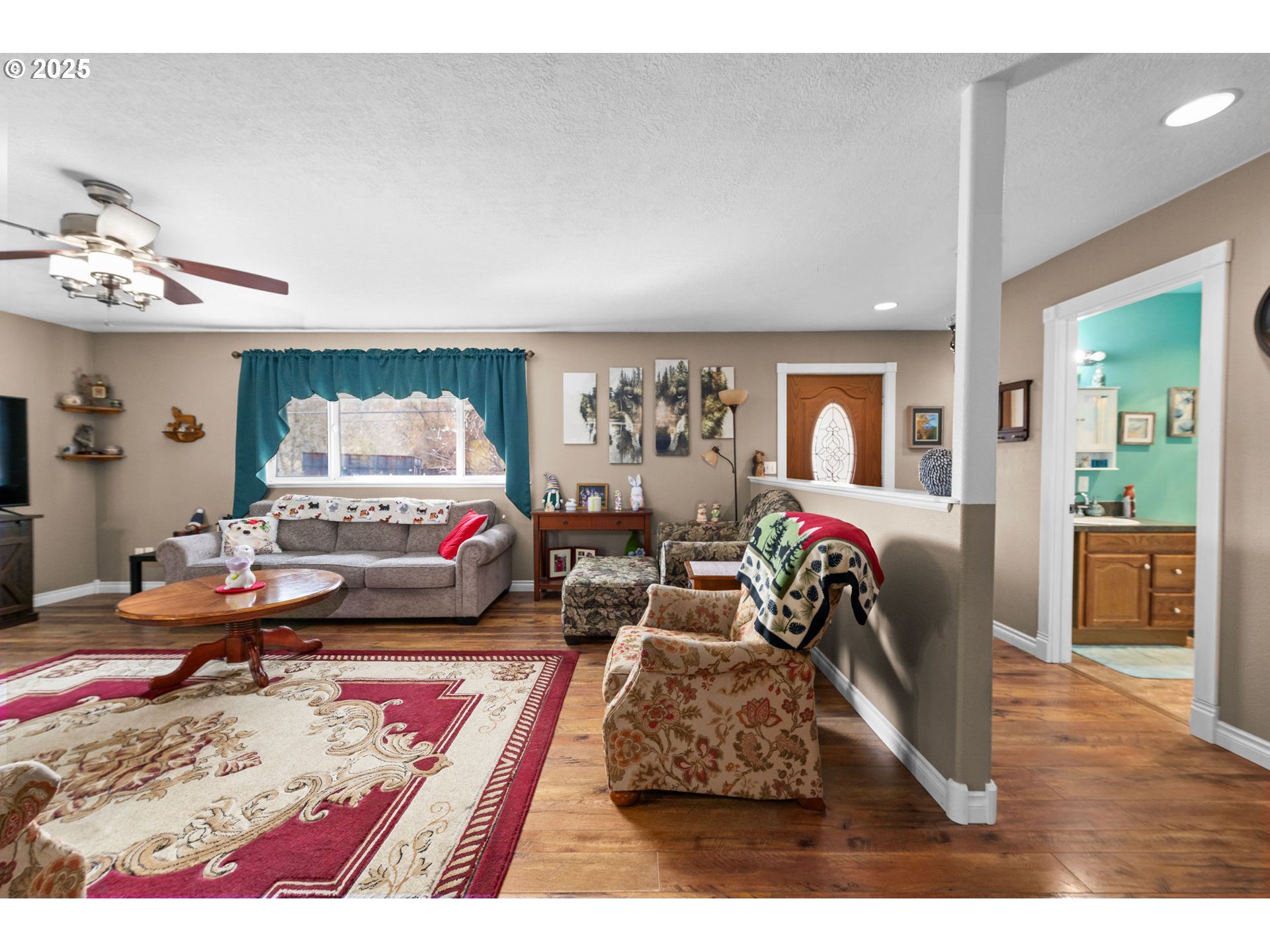 1390 Swedetown Road Clatskanie, OR 97016 - Photo 17 of 42 a living room with furniture and a wooden floor