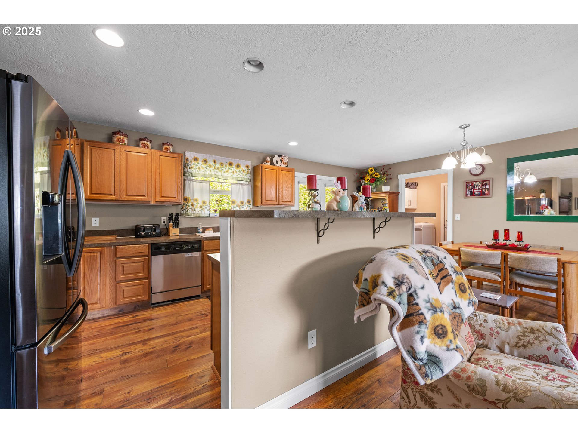 1390 Swedetown Road Clatskanie, OR 97016 - Photo 20 of 42 a kitchen view with stainless steel appliances wooden floor and seating