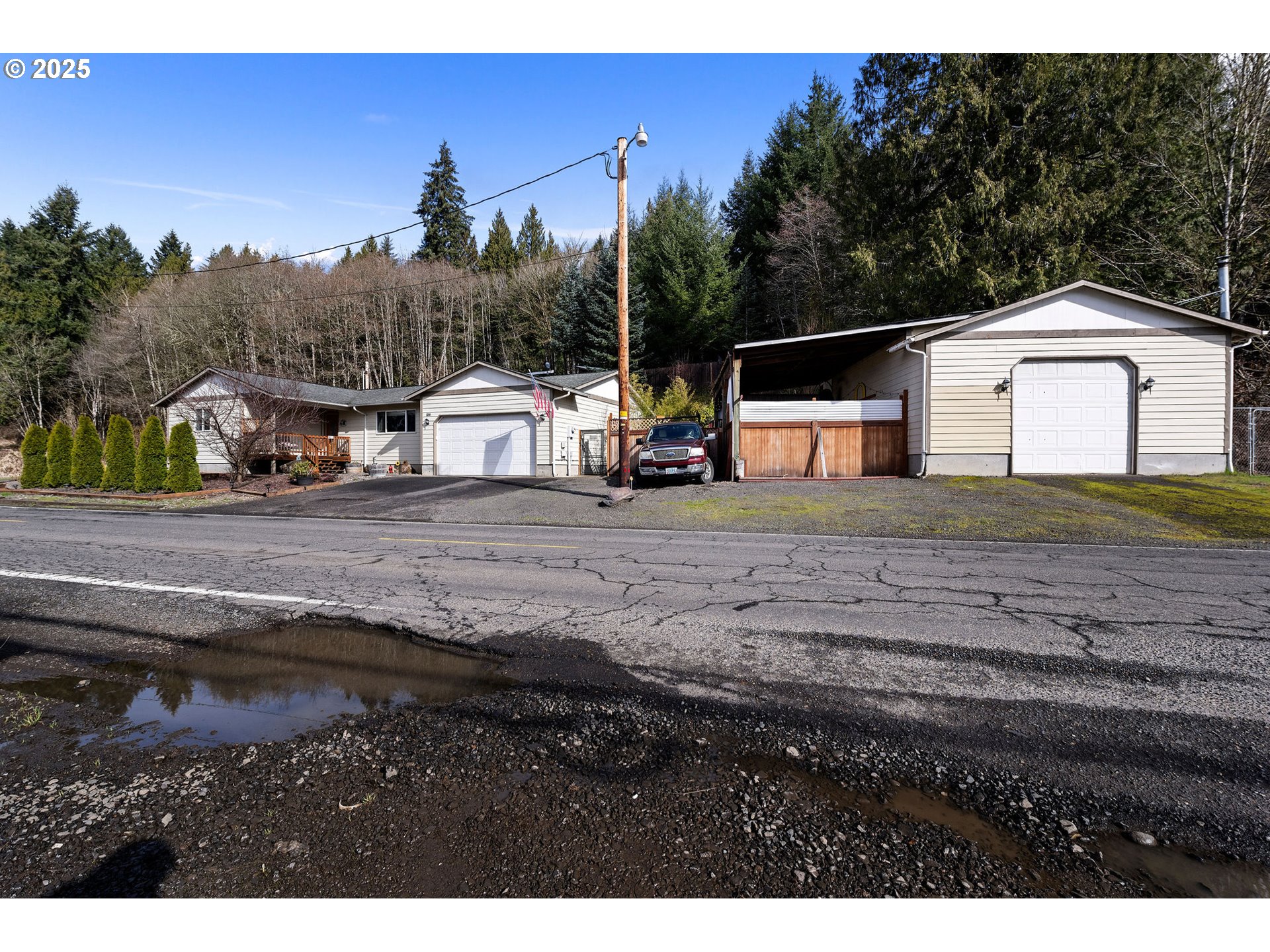 1390 Swedetown Road Clatskanie, OR 97016 - Photo 2 of 42 a view of a house with a yard