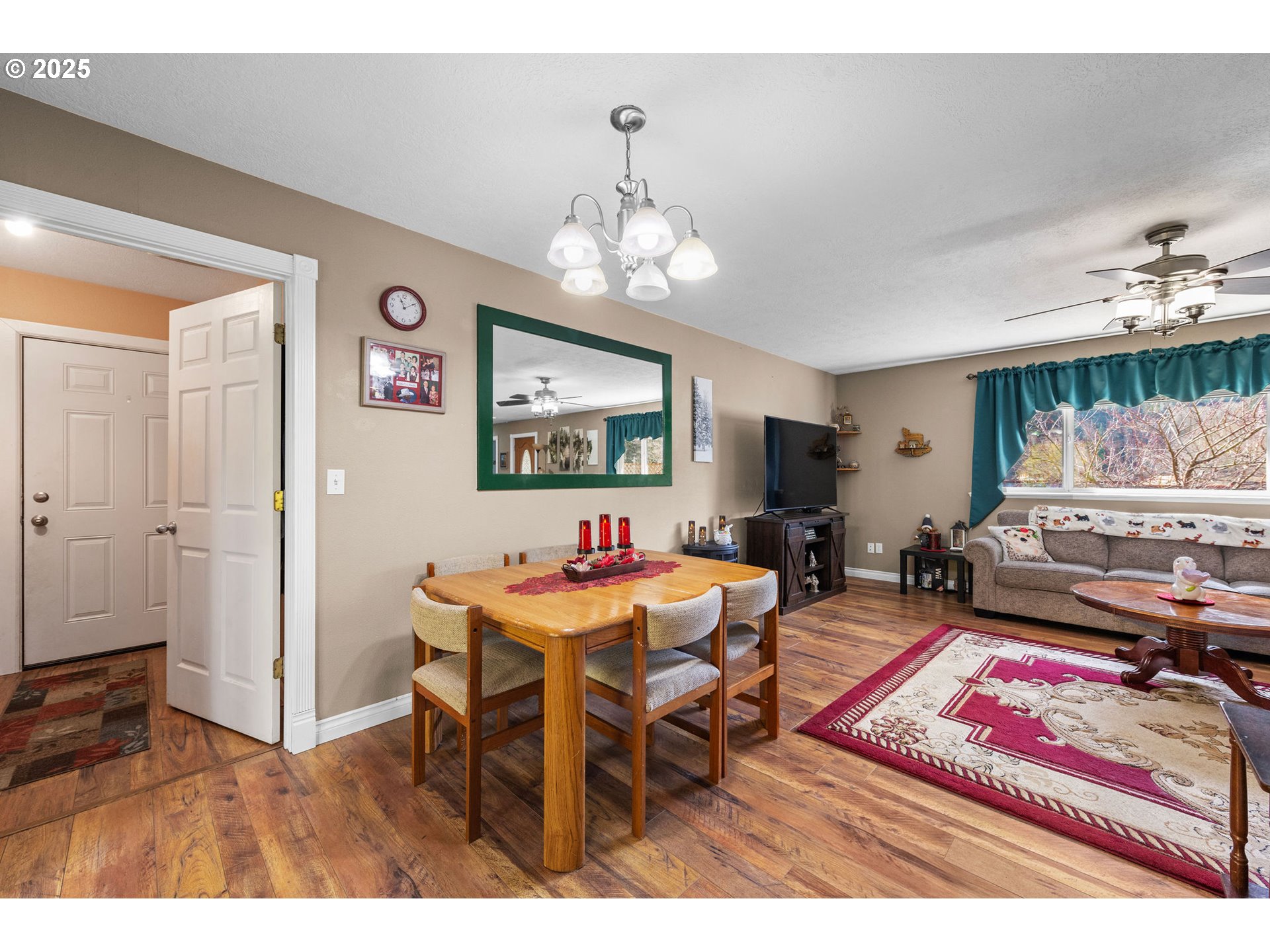 1390 Swedetown Road Clatskanie, OR 97016 - Photo 25 of 42 a living room with furniture a rug and a chandelier