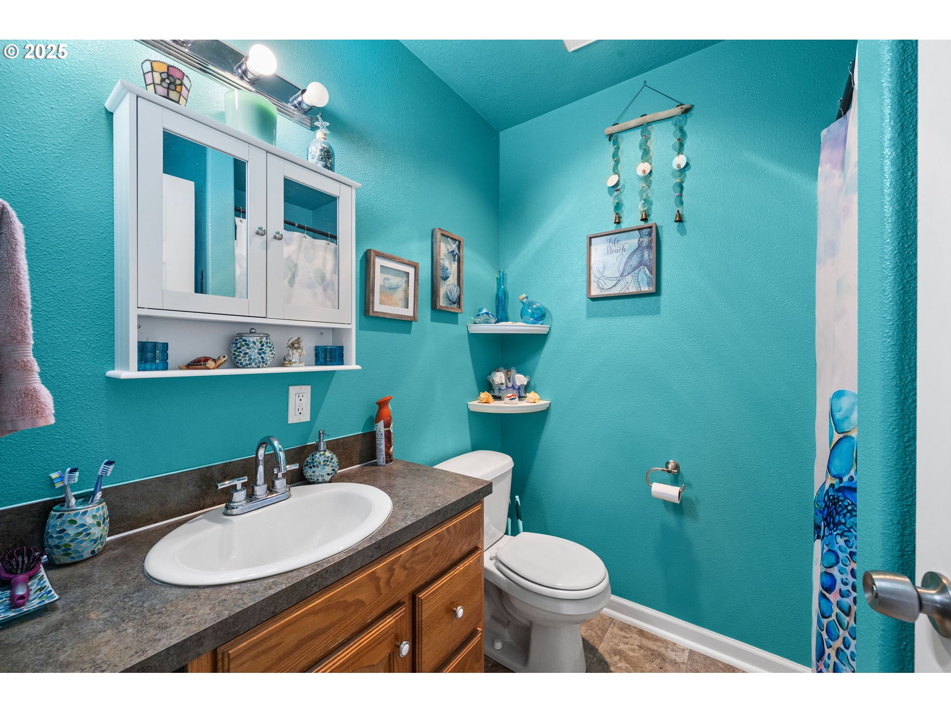 1390 Swedetown Road Clatskanie, OR 97016 - Photo 8 of 42 a bathroom with a toilet sink and mirror