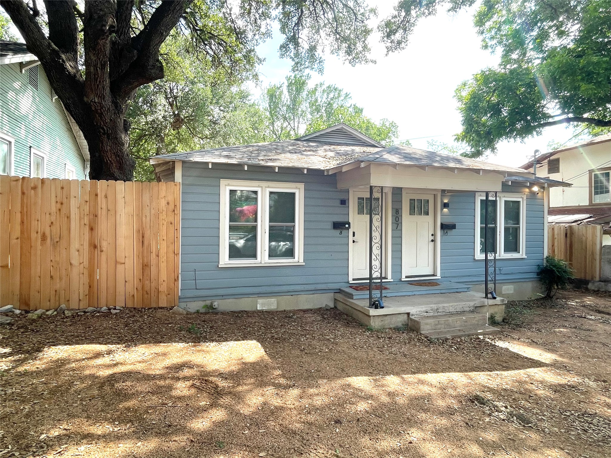 807 East Riverside Drive, Unit B Austin, TX 78704 - Photo 1 of 28 A welcoming light blue exterior with a simple front porch invites residents inside.